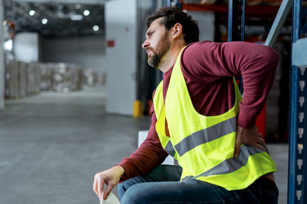Sydney tradies receiving back pain treatment at Spinal Care Sydney