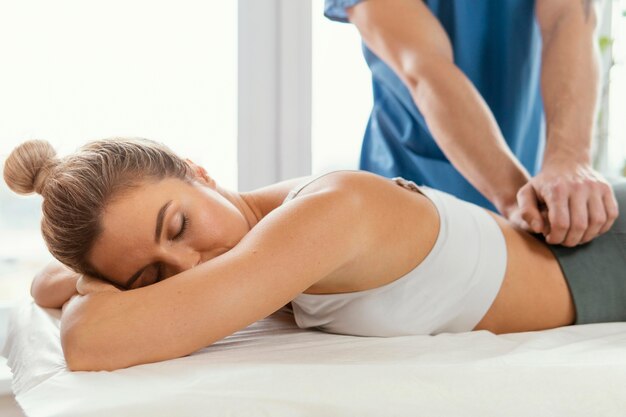 Chiropractor Cost in Sydney: Fees, Rebates and Gaps 1 Chiropractor treating lower back pain in Sydney